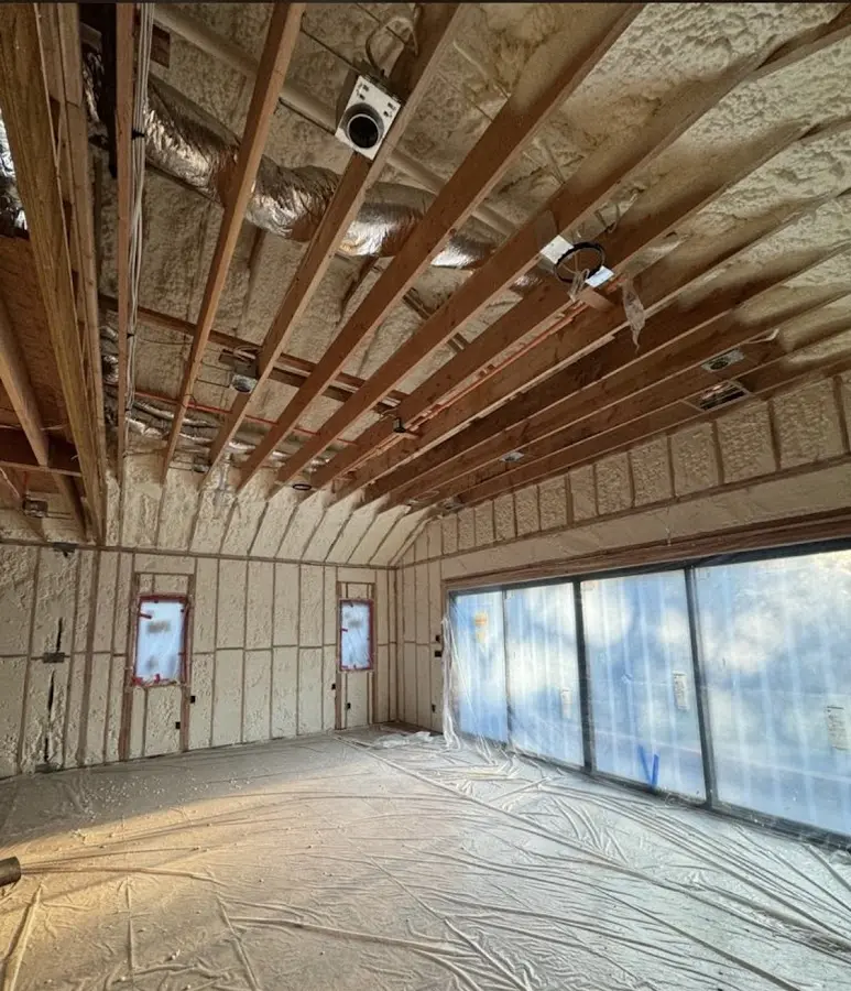 Interior walls and ceiling insulated with spray foam during new construction in Irvington